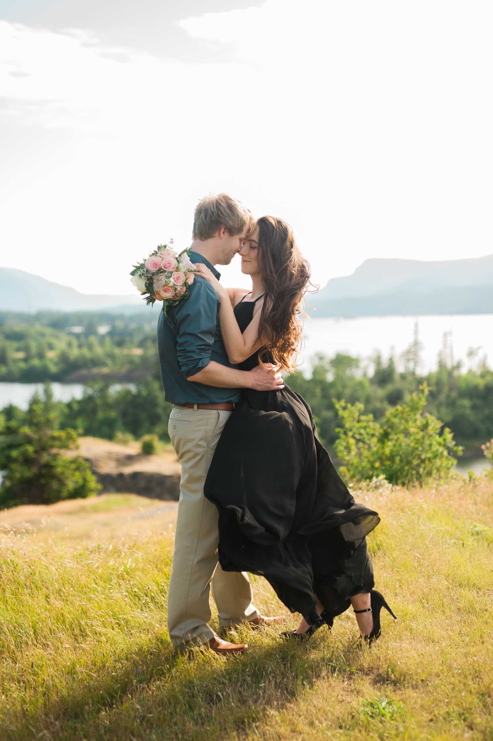 Engaged couple in a close embrace in the oregon Gorge